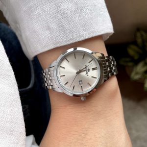 ساعت مچی زنانه و مردانه استیل برند ELEGANCE با طراحی کلاسیک و صفحه نقره‌ای